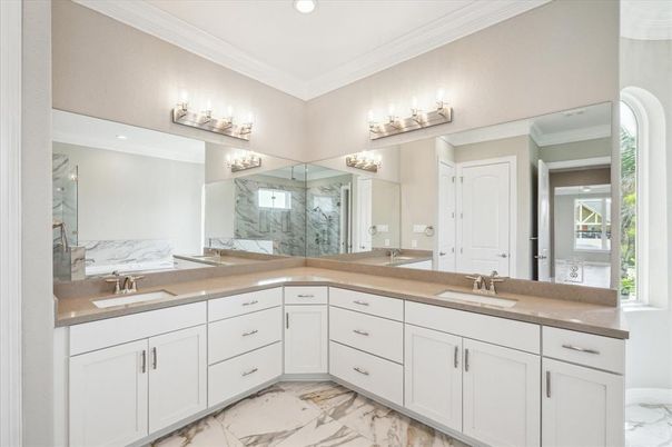 Bathroom, Dual Sink Vanities, Glass Shower, Interior, Marble, Marble Walls, Recessed Lighting
