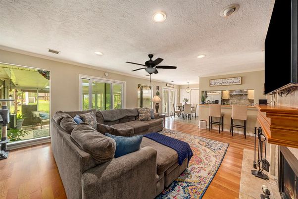 Dining room, Fireplace, Interior, Living room, Pendant Lights, Recessed Lighting, Wood Texture Flooring