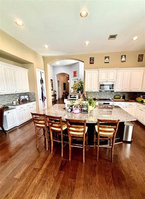 Dining room, Interior, Kitchen, Recessed Lighting, Stainless Steel Appliances, Wood Texture Flooring