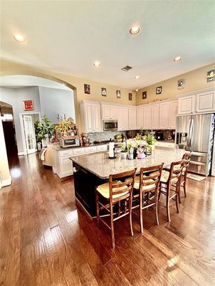 Dining room, Interior, Kitchen, Living room, Recessed Lighting, Stainless Steel Appliances, Wood Texture Flooring