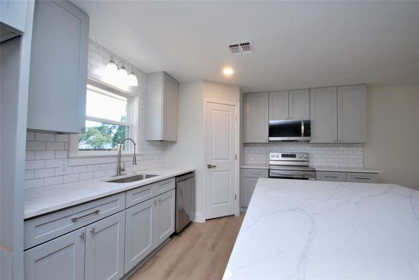 Interior, Kitchen, Recessed Lighting, Stainless Steel Appliances, Wood Texture Flooring