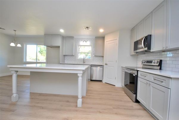 Interior, Kitchen, Pendant Lights, Recessed Lighting, Stainless Steel Appliances, Wood Texture Flooring