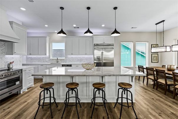 Dining room, Interior, Kitchen, Pendant Lights, Recessed Lighting, Stainless Steel Appliances, Wood Texture Flooring