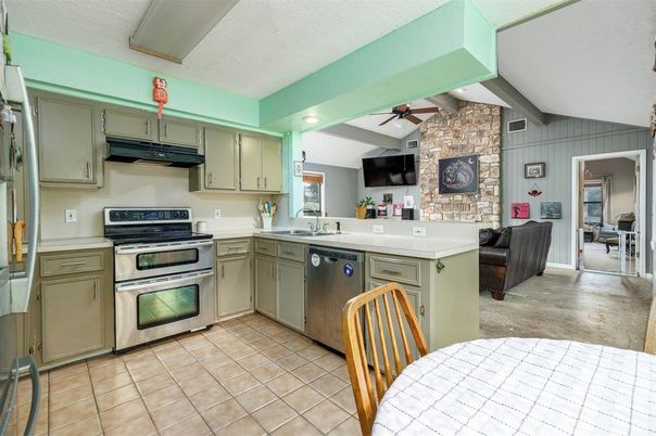 Interior, Kitchen, Recessed Lighting, Stainless Steel Appliances, Stone Walls