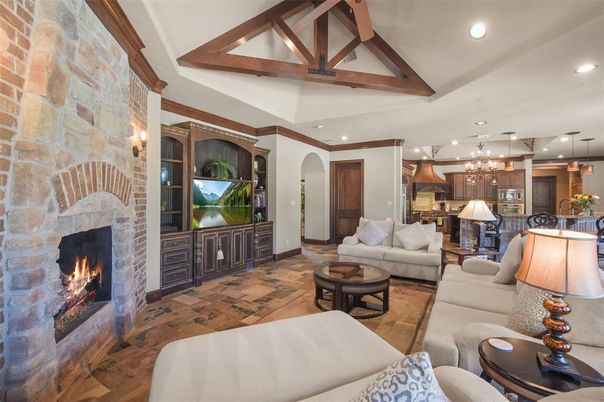 Fireplace, Interior, Kitchen, Living room, Pendant Lights, Recessed Lighting, Stainless Steel Appliances, Stone Walls, Wooden Beams, Wood Texture Flooring