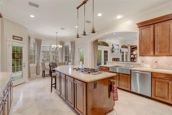 Chandelier, Dining room, Fireplace, Interior, Kitchen, Pendant Lights, Recessed Lighting, Stainless Steel Appliances