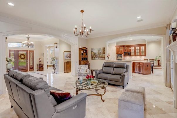 Chandelier, Fireplace, Interior, Kitchen, Living room, Recessed Lighting, Stainless Steel Appliances