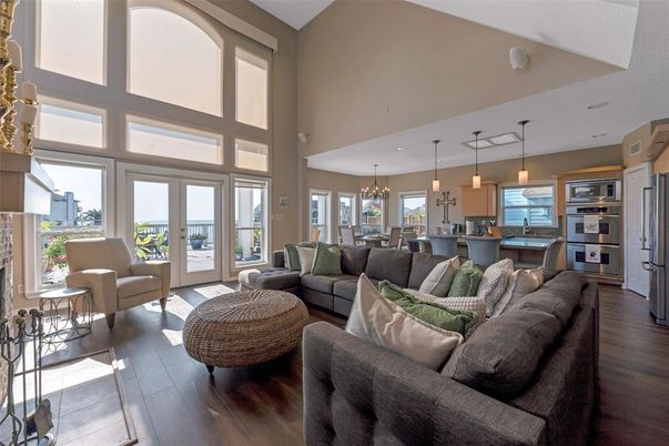 Chandelier, Dining room, Interior, Kitchen, Living room, Pendant Lights, Stainless Steel Appliances, Wood Texture Flooring
