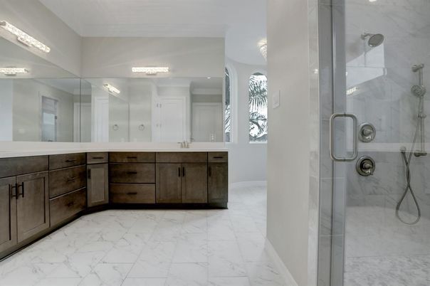 Bathroom, Dual Sink Vanities, Glass Shower, Interior, Marble, Marble Walls, Recessed Lighting