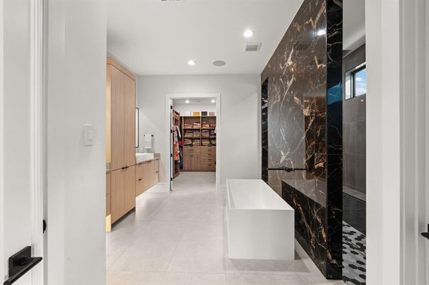 Bathroom, Free Standing Baths, Interior, Marble Walls, Recessed Lighting, Walk-in Closets