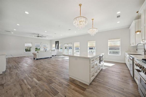 Chandelier, Interior, Kitchen, Living room, Recessed Lighting, Stainless Steel Appliances, Wood Texture Flooring