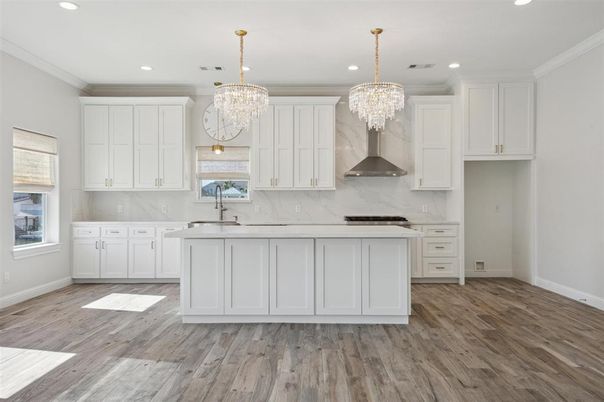 Chandelier, Interior, Kitchen, Marble Walls, Recessed Lighting, Stainless Steel Appliances, Wood Texture Flooring