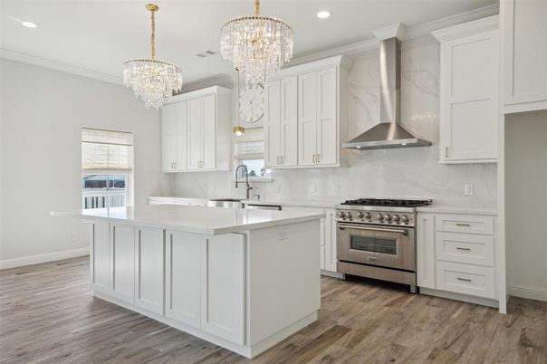 Chandelier, Interior, Kitchen, Marble Walls, Recessed Lighting, Stainless Steel Appliances, Wood Texture Flooring