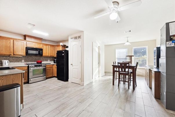 Dining room, Interior, Kitchen, Pendant Lights, Stainless Steel Appliances, Wood Texture Flooring