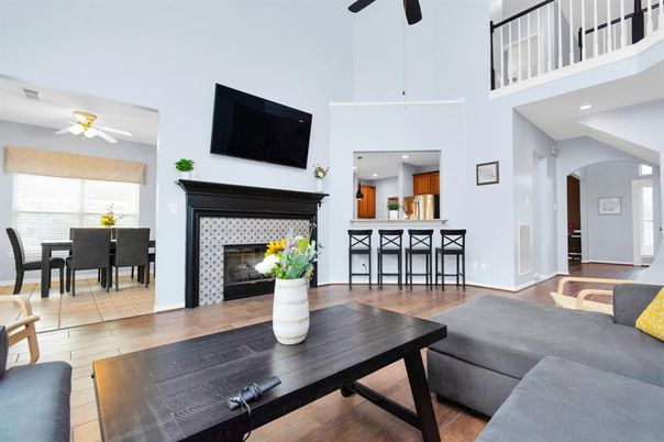 Dining room, Fireplace, Interior, Kitchen, Living room, Recessed Lighting, Wood Texture Flooring