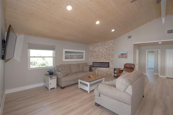 Fireplace, Interior, Living room, Recessed Lighting, Stone Walls, Wooden Ceilings, Wood Texture Flooring