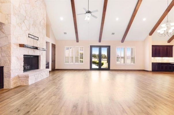 Empty room, Fireplace, Interior, Recessed Lighting, Stone Walls, Wooden Beams, Wood Texture Flooring