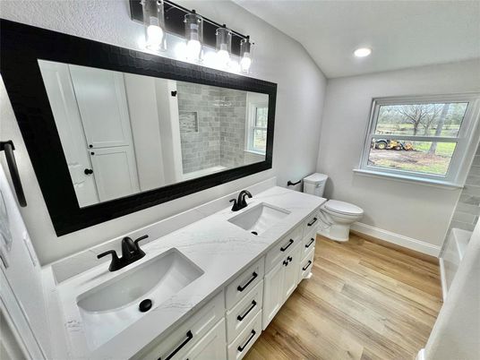 Bathroom, Dual Sink Vanities, Interior, Recessed Lighting, Wood Texture Flooring