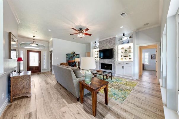 Fireplace, Interior, Living room, Pendant Lights, Recessed Lighting, Stone Walls, Wood Texture Flooring