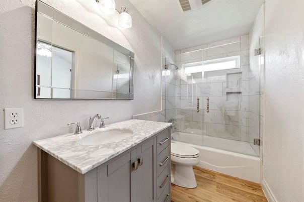 Bathroom, Glass Shower, Interior, Marble Walls, Wood Texture Flooring