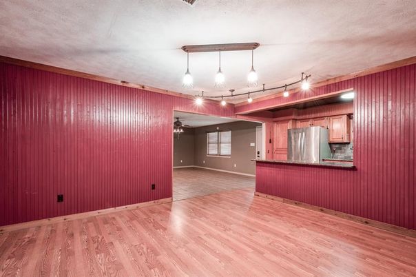 Empty room, Interior, Kitchen, Pendant Lights, Stainless Steel Appliances, Wood Texture Flooring