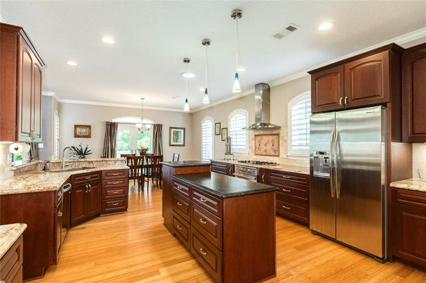 Dining room, Interior, Kitchen, Pendant Lights, Recessed Lighting, Stainless Steel Appliances, Wood Texture Flooring