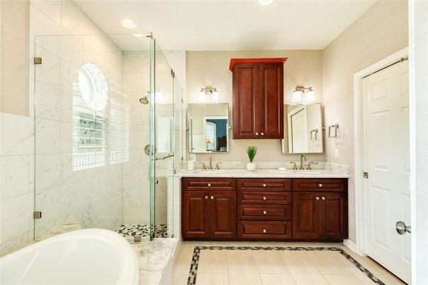 Bathroom, Dual Sink Vanities, Glass Shower, Interior, Marble Walls, Recessed Lighting