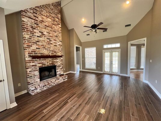 Empty room, Fireplace, Interior, Recessed Lighting, Stone Walls, Wood Texture Flooring