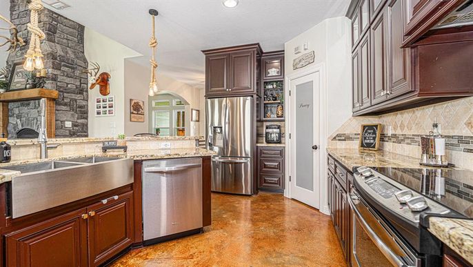 Fireplace, Interior, Kitchen, Pendant Lights, Recessed Lighting, Stainless Steel Appliances, Stone Walls