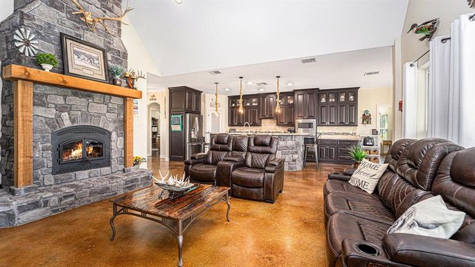 Fireplace, Interior, Kitchen, Living room, Pendant Lights, Recessed Lighting, Stainless Steel Appliances, Stone Walls