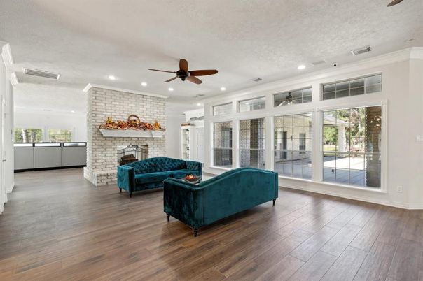 Fireplace, Interior, Living room, Recessed Lighting, Stone Walls, Wood Texture Flooring