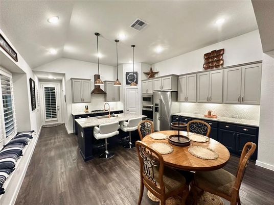Dining room, Interior, Kitchen, Pendant Lights, Recessed Lighting, Stainless Steel Appliances, Wood Texture Flooring