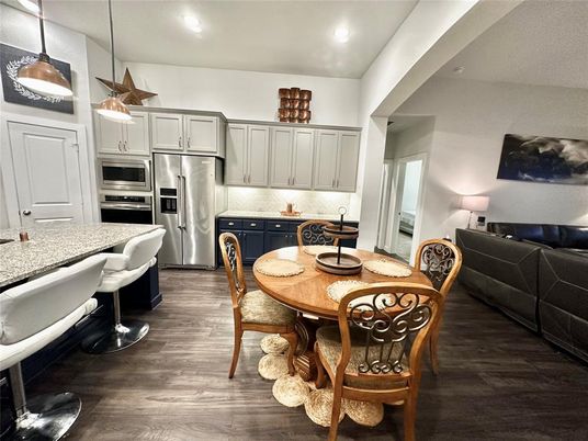 Dining room, Interior, Kitchen, Living room, Pendant Lights, Recessed Lighting, Stainless Steel Appliances, Wood Texture Flooring