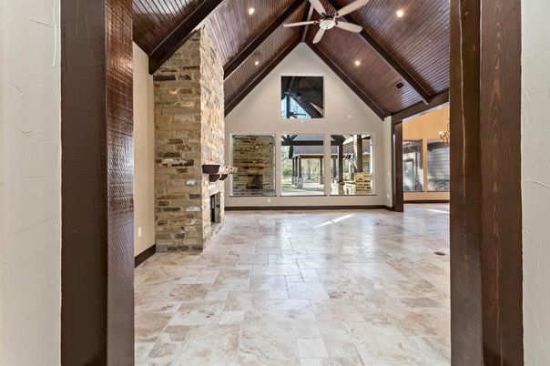 Empty room, Fireplace, Interior, Recessed Lighting, Stone Walls, Wooden Beams, Wooden Ceilings