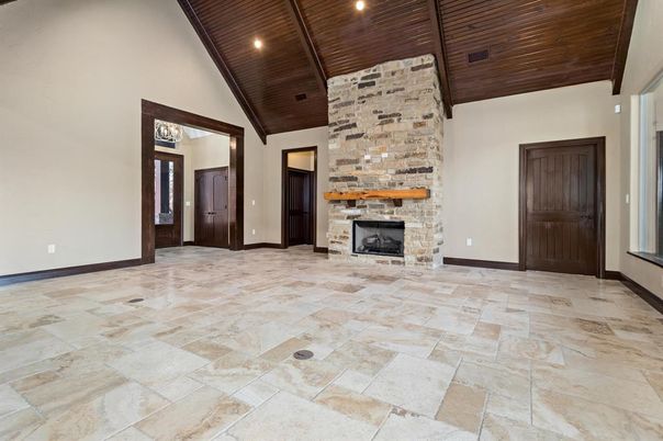 Empty room, Fireplace, Interior, Recessed Lighting, Stone Walls, Wooden Ceilings