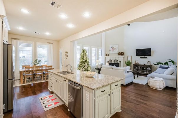 Dining room, Fireplace, Interior, Kitchen, Living room, Recessed Lighting, Stainless Steel Appliances, Wood Texture Flooring