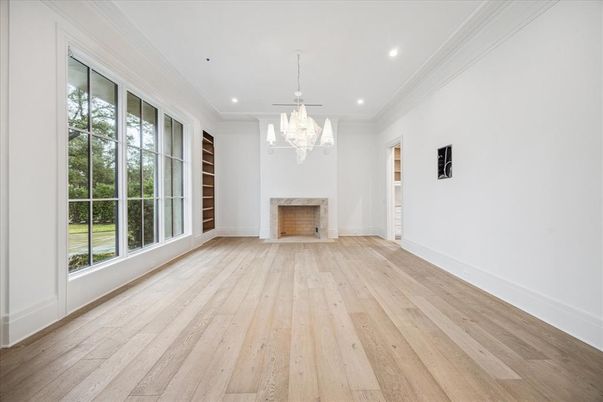 Chandelier, Empty room, Fireplace, Interior, Recessed Lighting, Wood Texture Flooring