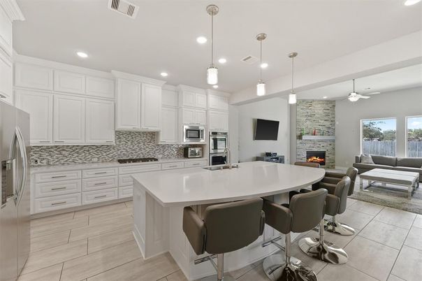 Dining room, Fireplace, Interior, Kitchen, Living room, Pendant Lights, Recessed Lighting, Stainless Steel Appliances, Stone Walls