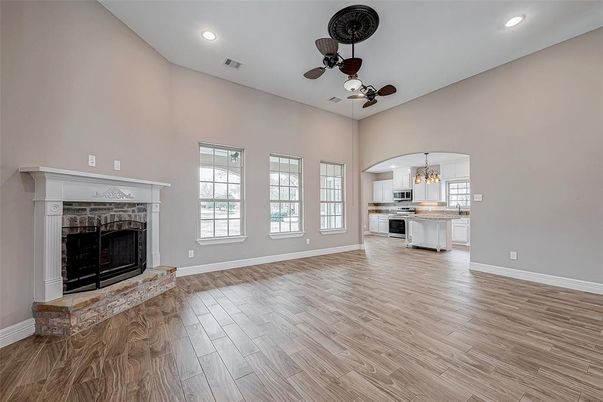Chandelier, Empty room, Fireplace, Interior, Kitchen, Recessed Lighting, Wood Texture Flooring