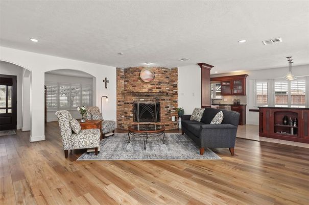 Fireplace, Interior, Living room, Pendant Lights, Recessed Lighting, Stone Walls, Wood Texture Flooring