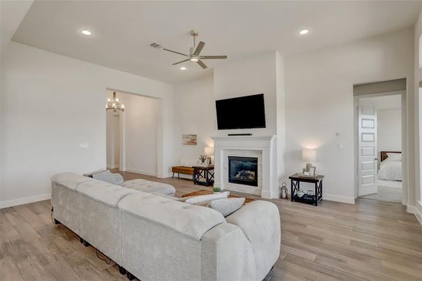 Bedroom, Chandelier, Fireplace, Interior, Living room, Recessed Lighting, Wood Texture Flooring