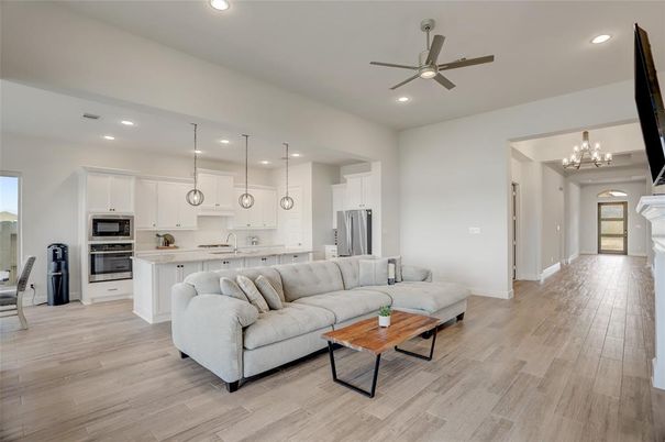 Chandelier, Interior, Kitchen, Living room, Pendant Lights, Recessed Lighting, Stainless Steel Appliances, Wood Texture Flooring