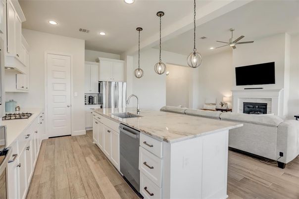 Fireplace, Interior, Kitchen, Living room, Pendant Lights, Recessed Lighting, Stainless Steel Appliances, Wood Texture Flooring