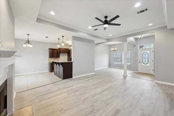 Chandelier, Empty room, Fireplace, Interior, Kitchen, Pendant Lights, Recessed Lighting, Wood Texture Flooring