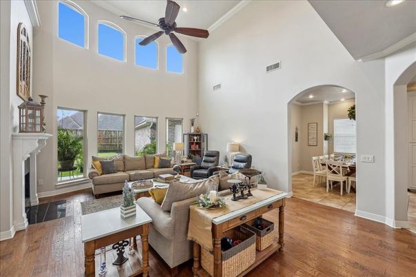 Dining room, Fireplace, Interior, Living room, Recessed Lighting, Wood Texture Flooring