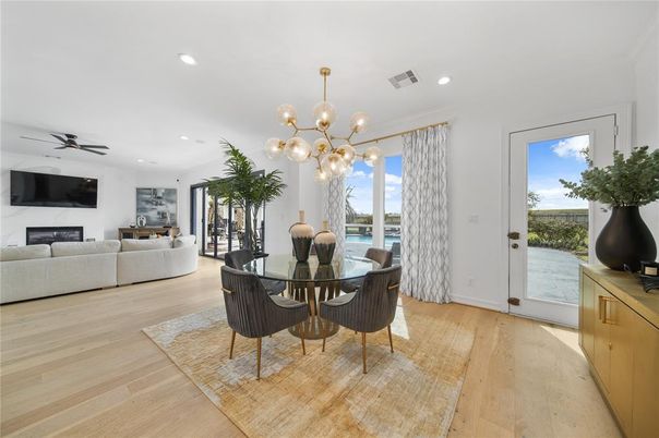 Dining room, Fireplace, Interior, Living room, Pendant Lights, Recessed Lighting, Wood Texture Flooring