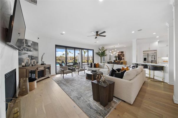 Chandelier, Dining room, Interior, Kitchen, Living room, Recessed Lighting, Stainless Steel Appliances, Wood Texture Flooring