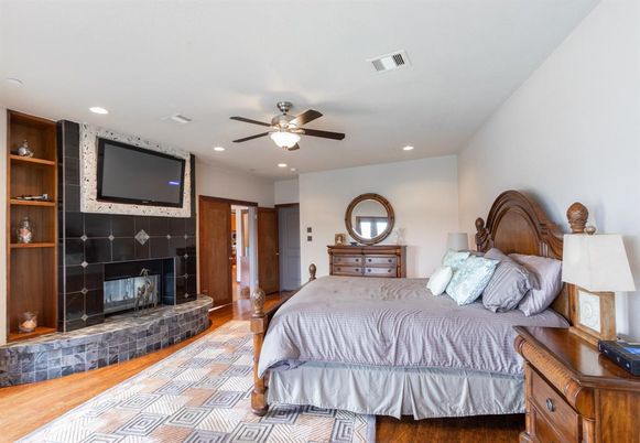 Bedroom, Fireplace, Interior, Recessed Lighting, Wood Texture Flooring