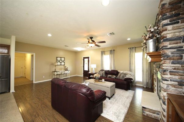 Fireplace, Interior, Living room, Recessed Lighting, Stone Walls, Wood Texture Flooring