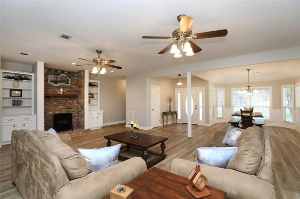 Dining room, Fireplace, Interior, Living room, Pendant Lights, Stone Walls, Wood Texture Flooring